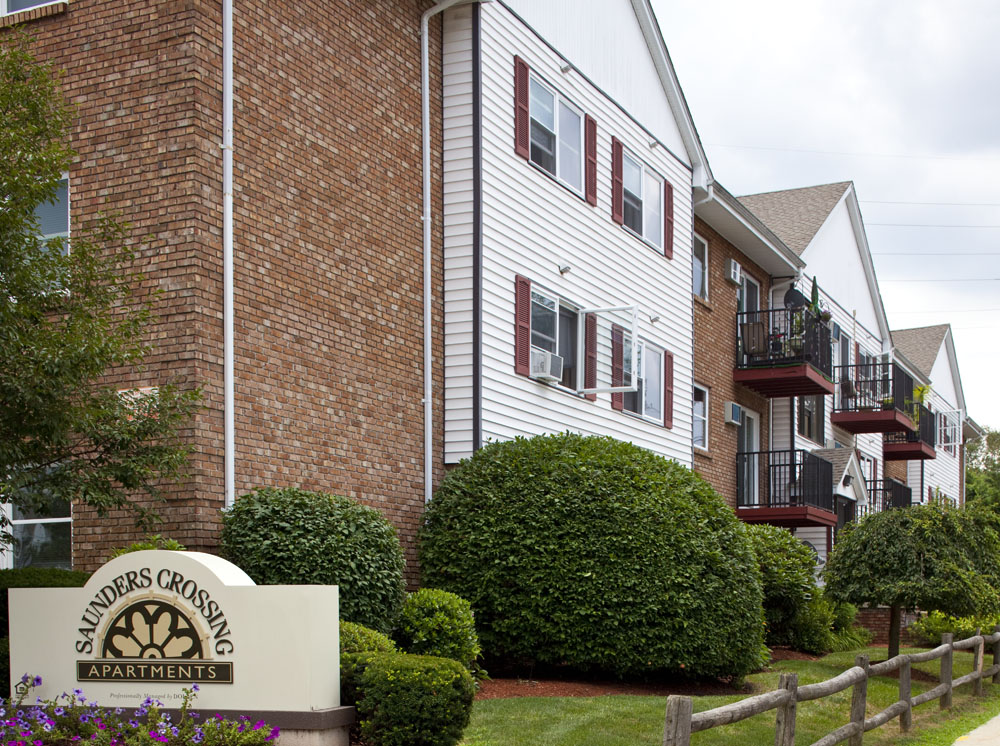 Exterior view of Saunders Crossing apartments managed by Dolben in Lawrence, MA